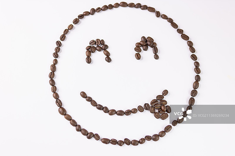白色背景上的咖啡豆表情符号图片素材