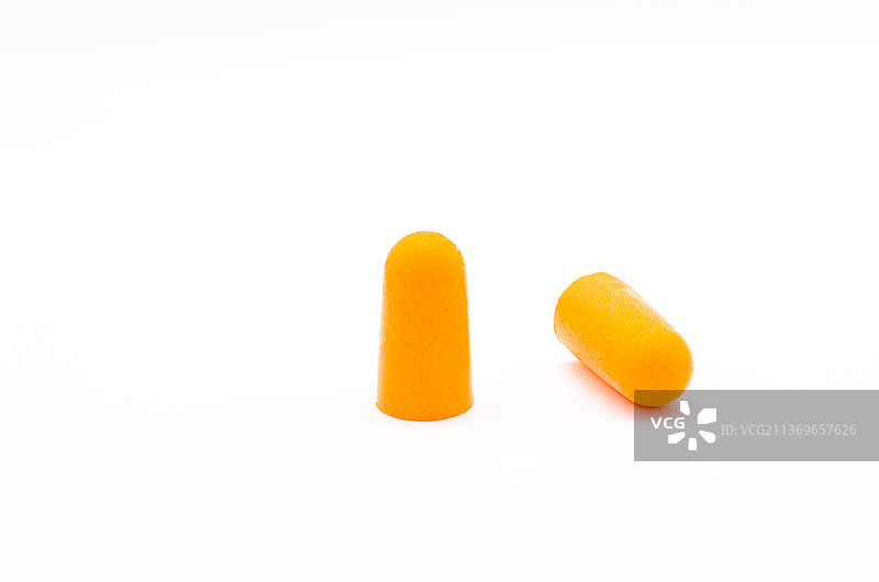 亚洲中国内室内影棚拍摄静物，一对黄色的防噪耳塞图片素材