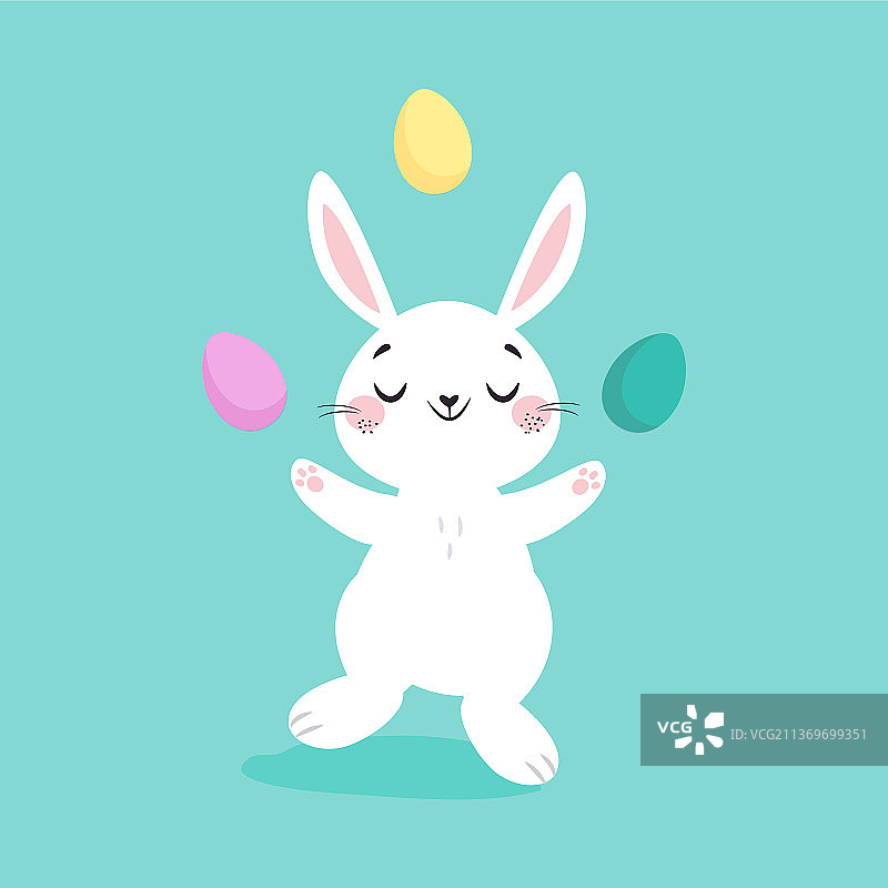 白色复活节兔子在玩彩色鸡蛋图片素材