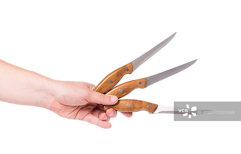 手持三把厨房刀具图片素材