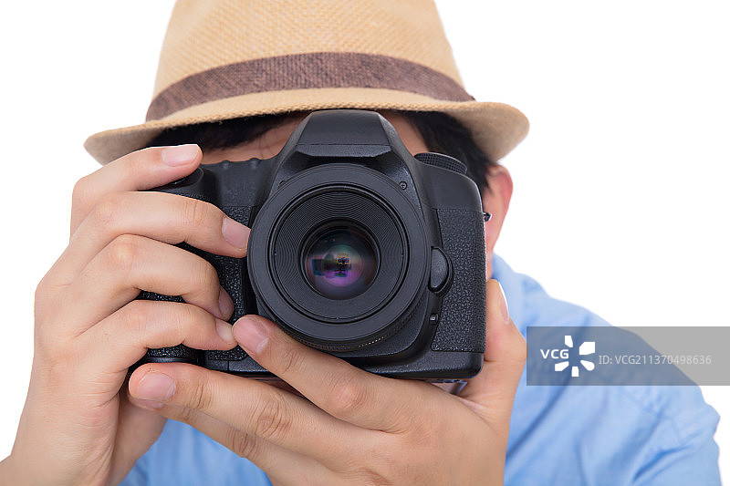 使用单反相机拍照的摄影师图片素材