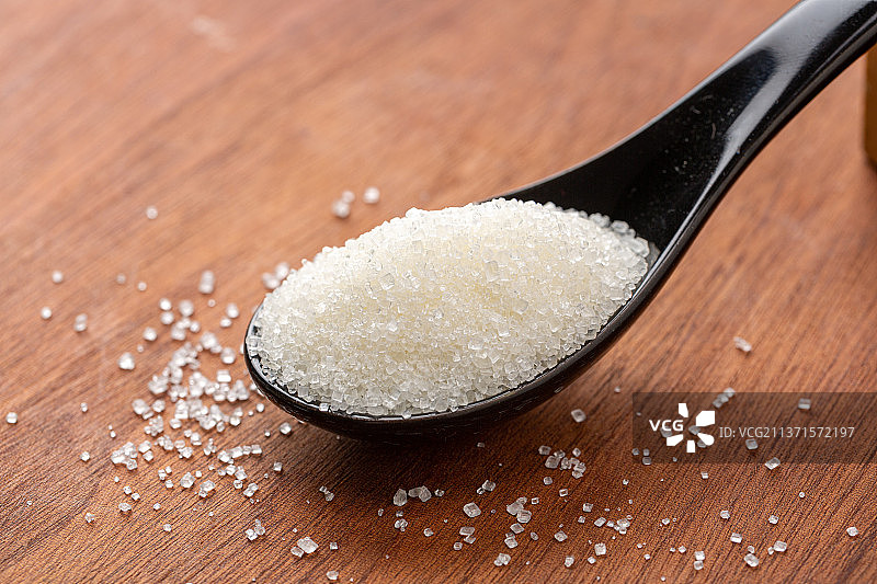 勺子里的白砂糖特写图片素材