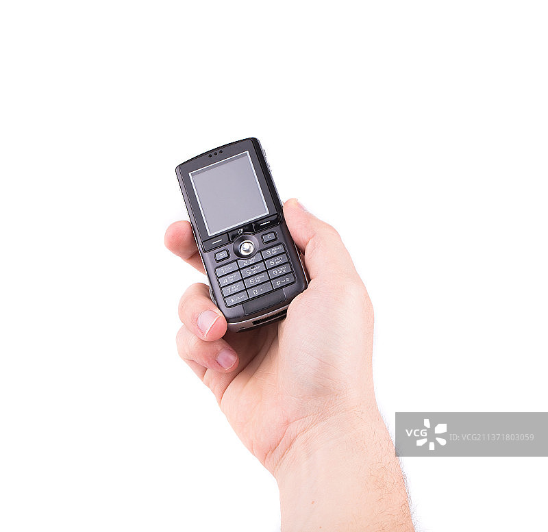 手持黑色手机，手持老式电话，白色背景，摩尔多瓦图片素材