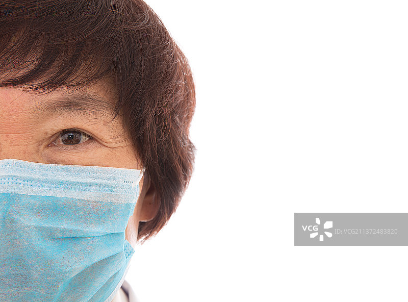 戴着口罩的医生半边脸特写图片素材