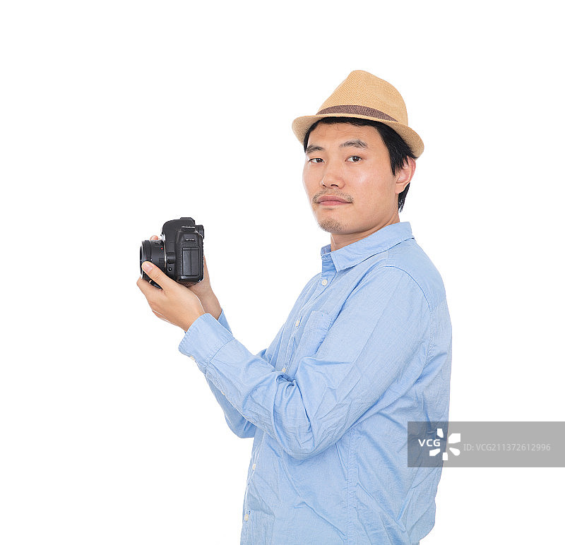 手拿单反相机的男摄影师图片素材