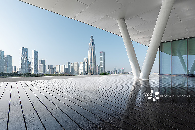 深圳后海CBD建筑群和空白无人的木地板空间图片素材