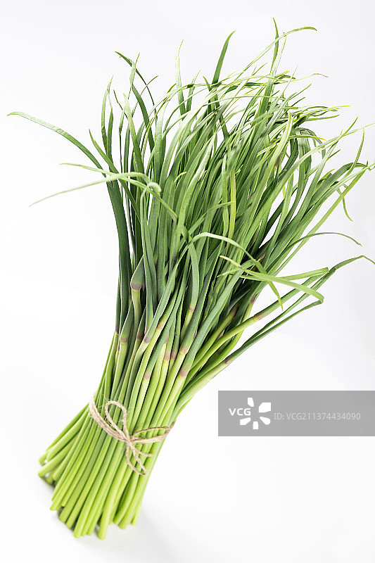 一把新鲜的蒜薹特写图片素材