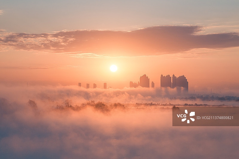 新疆伊宁市伊宁河大桥日出图片素材