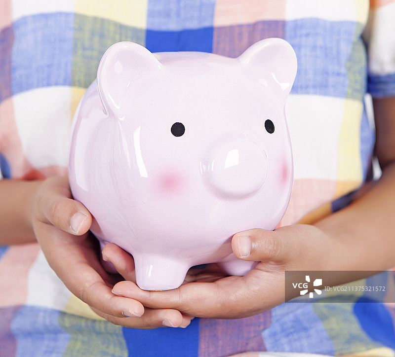 手中的存钱罐图片素材