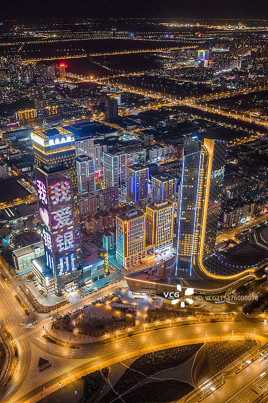航拍航拍宁夏银川地标摩天大楼夜景灯光秀图片素材