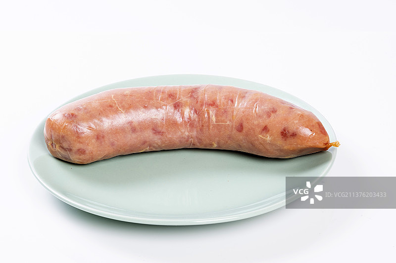一根香肠摆放在桌面上特写图片素材