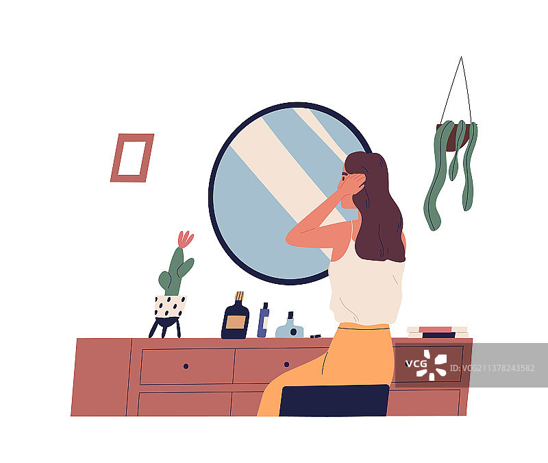 年轻女子坐在梳妆台上打扮图片素材
