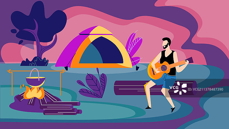 男子夜晚坐在篝火旁弹吉他图片素材