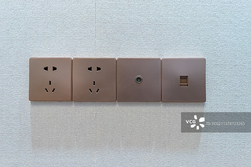 中国城市健康生活拍摄主题，住宅内部环境，起居室里的墙壁上的家电开关和插座，室内无人图像摄影图片素材
