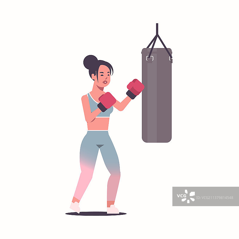 女拳击手用拳击袋做练习图片素材