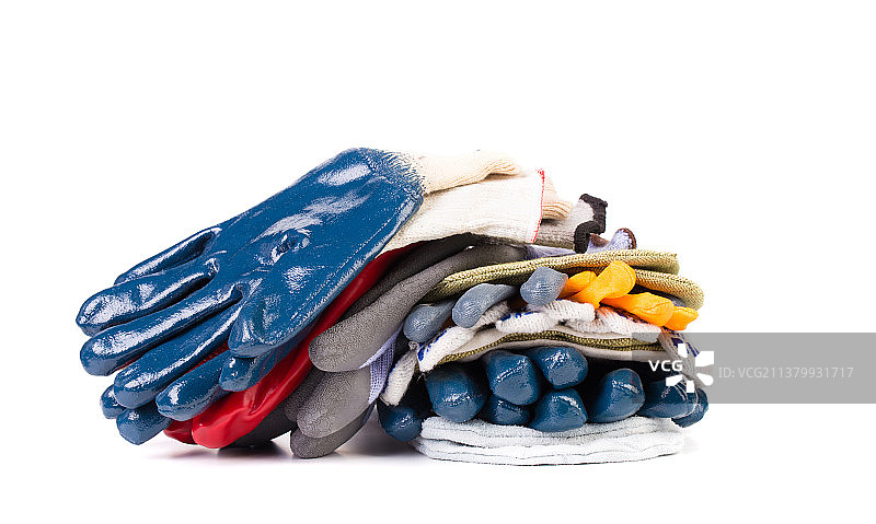 堆叠的防护手套，白色背景上的玩具特写，摩尔多瓦图片素材