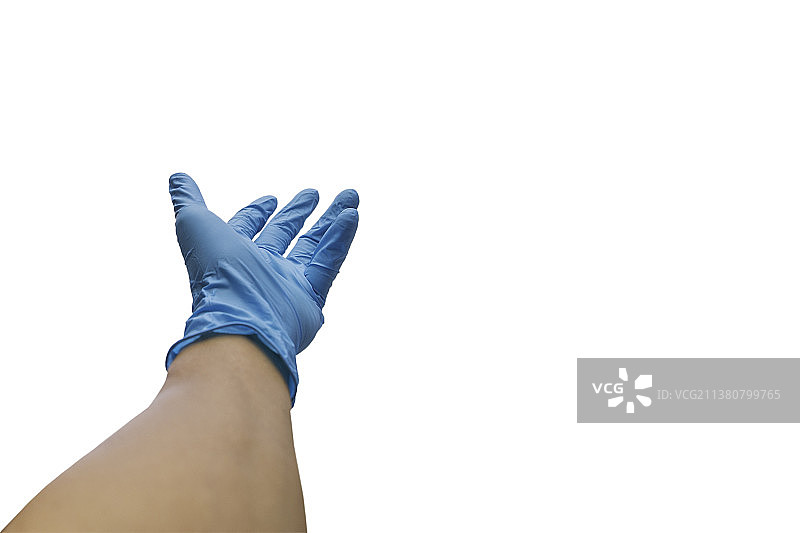 戴着医用手套的手伸出来，在剪切路径中隔离，泰国图片素材
