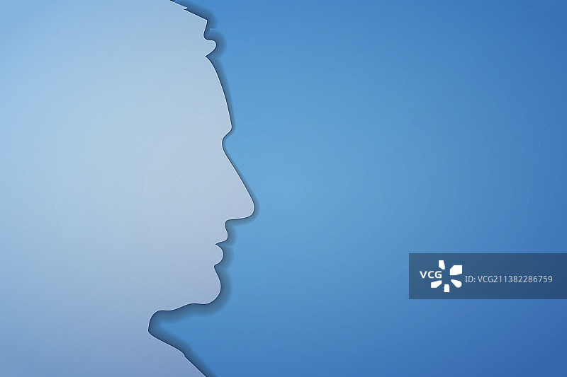 蓝色背景上的剪纸男人脸部轮廓图片素材