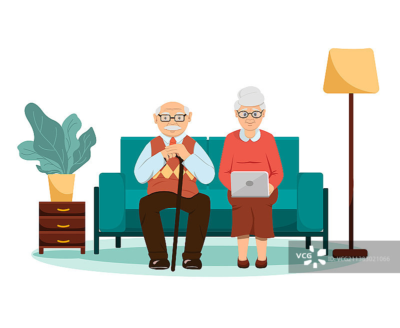 祖父母坐在沙发上使用笔记本电脑图片素材