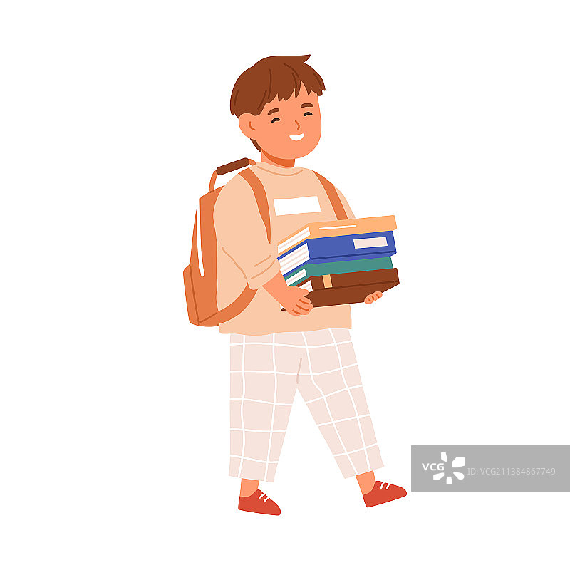 快乐儿童手里拿着一堆书走路图片素材