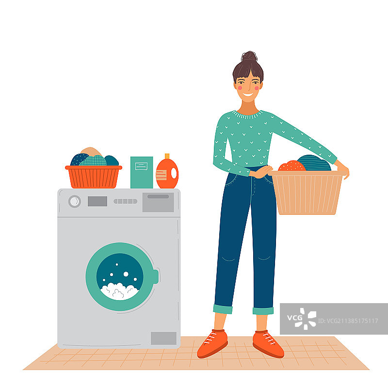 快乐的女人站在洗衣机旁图片素材