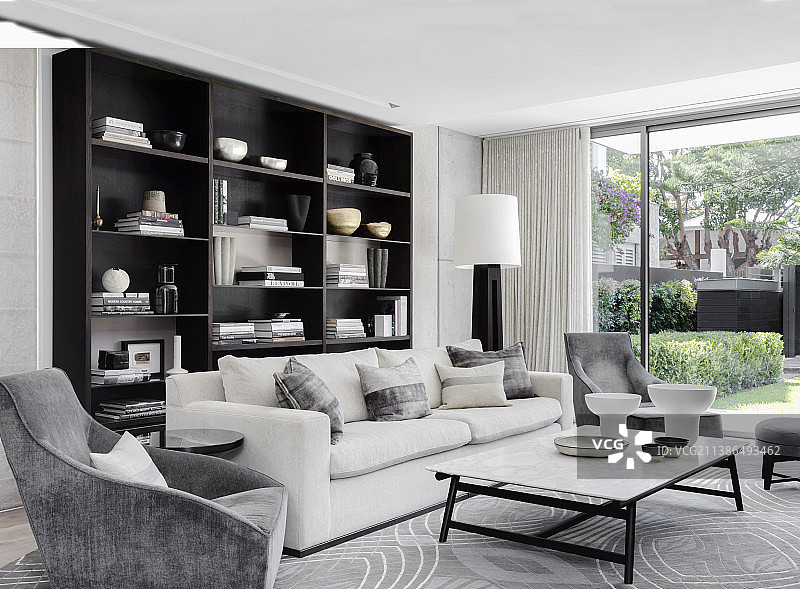 配有软垫家具和架子的优雅客厅图片素材