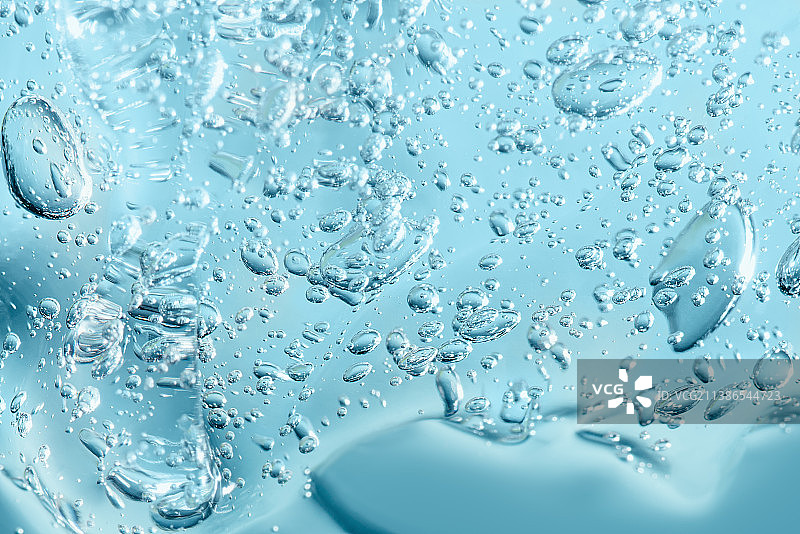 蓝色背景芦荟凝胶化妆品宏观纹理特写图片素材