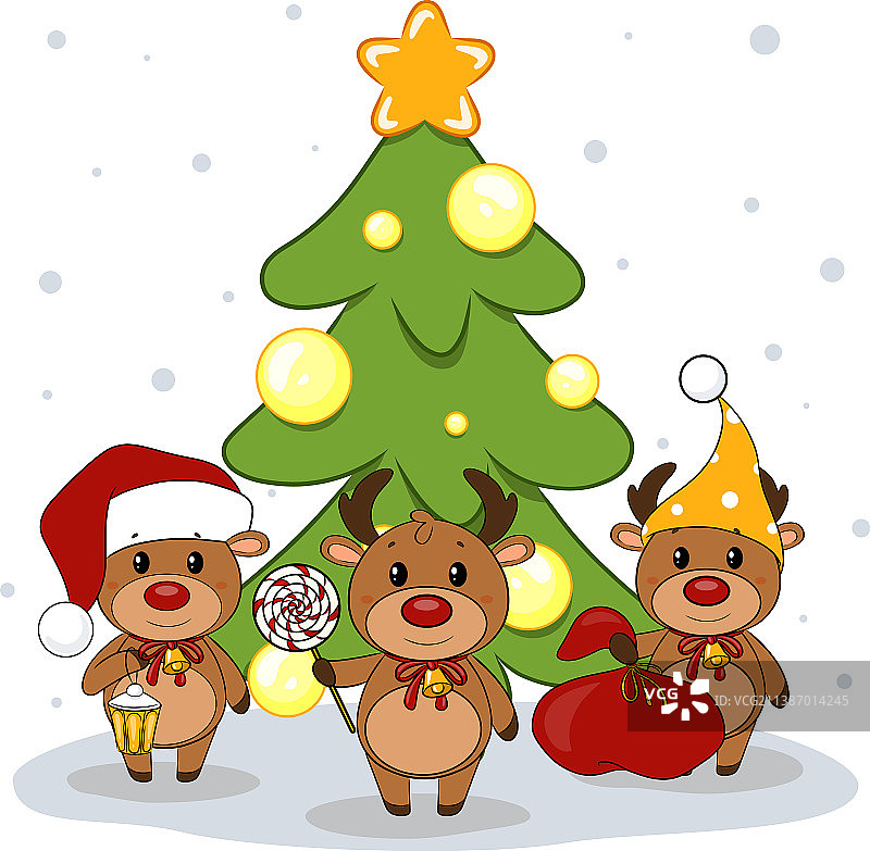 三只圣诞驯鹿和一棵圣诞树图片素材