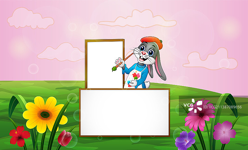 在绿色田野里绘画的快乐兔子图片素材