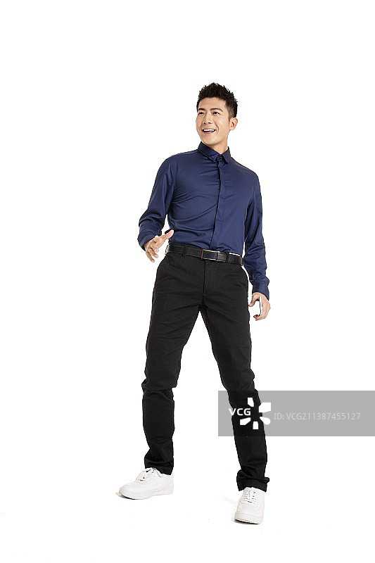 手拿手机动作夸张的年轻男性图片素材