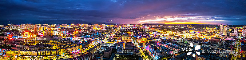 甘肃酒泉城市晚霞灯火楼房建筑图片素材
