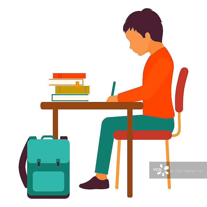 在书桌前做作业的学童男孩图片素材