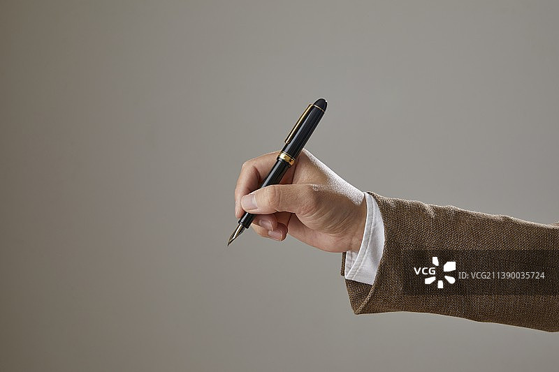 手持笔图片素材