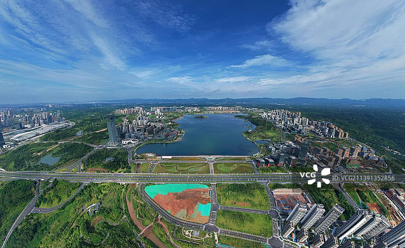 航拍晴天下的成都天府新区公园城市风景图片素材