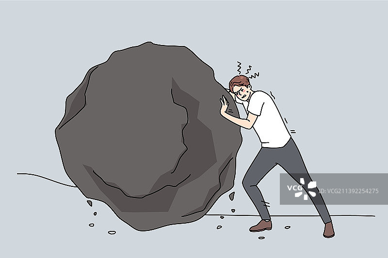 健壮的商人推动着沉重的石头图片素材