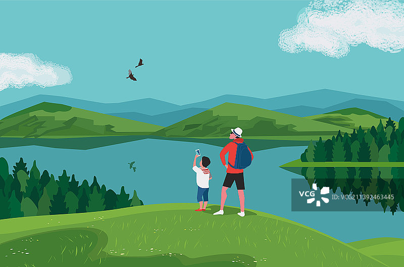 父子在湖边的山丘上徒步旅行图片素材