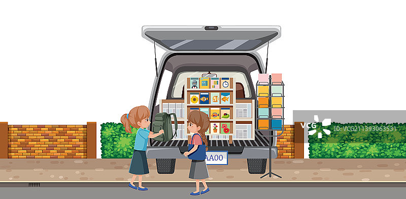 女孩们在庭院旧货出售会上购买贺卡图片素材