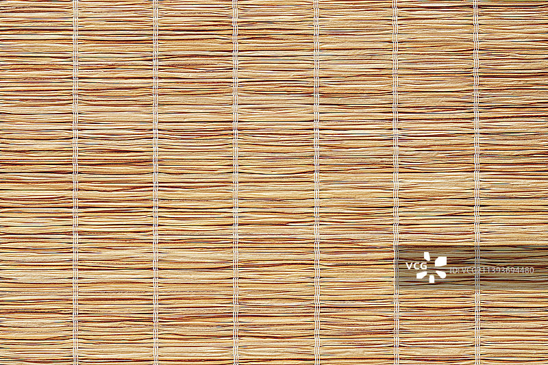 可再生有机材料的环保餐垫或桌布的草编纹理图片素材