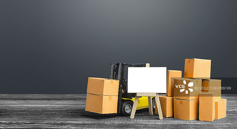 叉车与盒子和空白画架标志图片素材