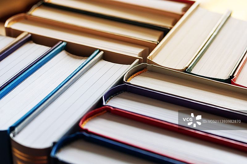 书店精装书堆叠背景图片素材
