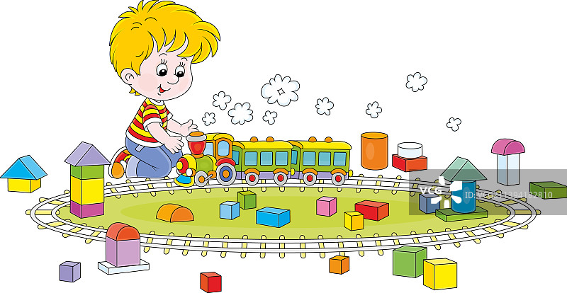 小男孩在游戏室玩玩具火车图片素材