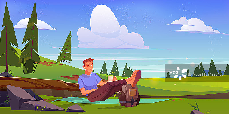 男人坐在绿色草甸的垫子上放松图片素材