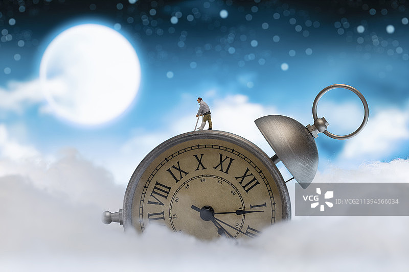 星空背景下的闹钟和模型小人图片素材