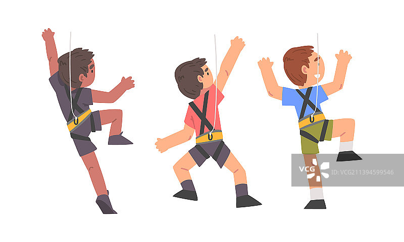 小男孩攀登陡峭的岩石或墙壁图片素材