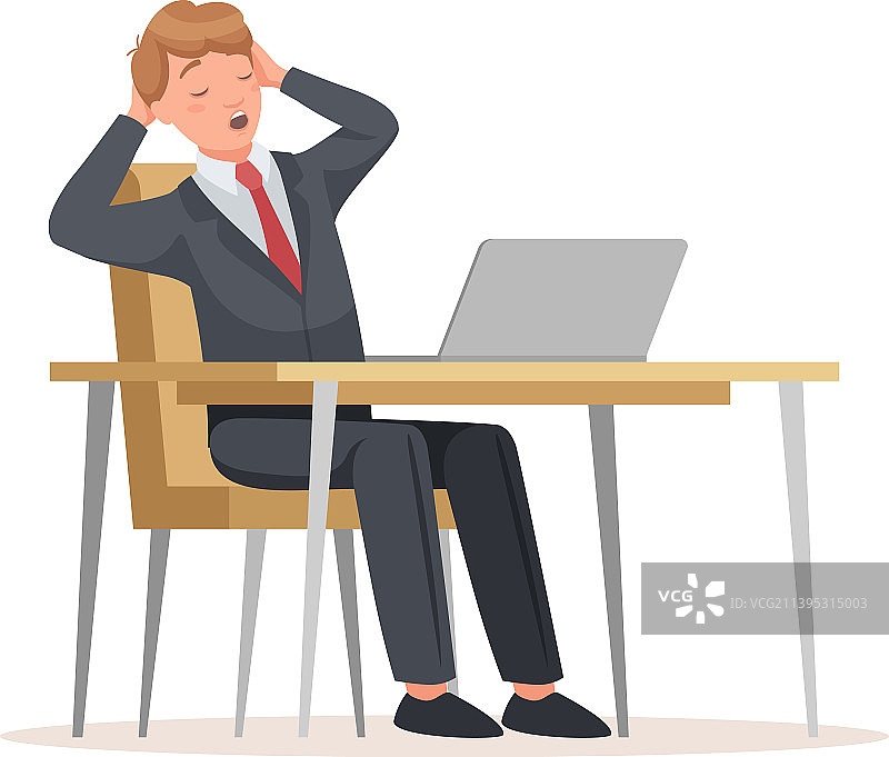 坐在办公桌前使用笔记本电脑的男人图片素材