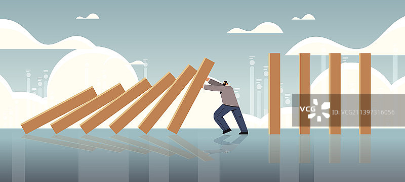 阻止多米诺骨牌效应危机的压力大的商人图片素材
