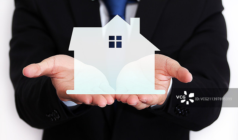 职业人士展示手上房子图片素材