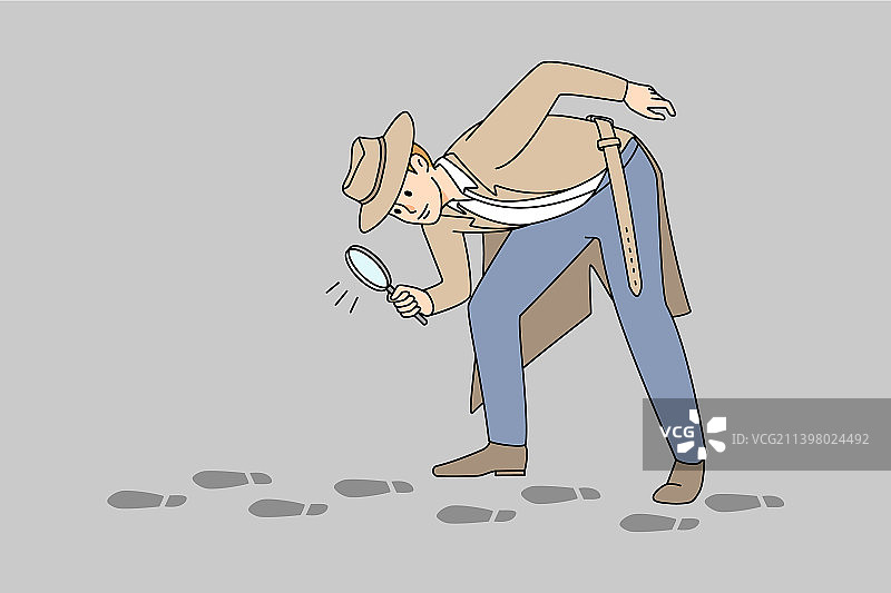 用放大镜跟随脚印的侦探图片素材