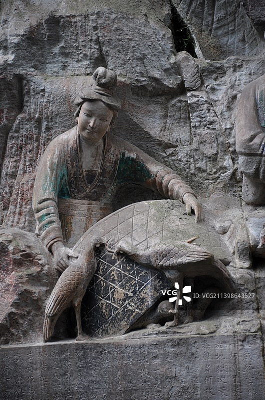 重庆大足石刻宝顶山养鸡女图片素材