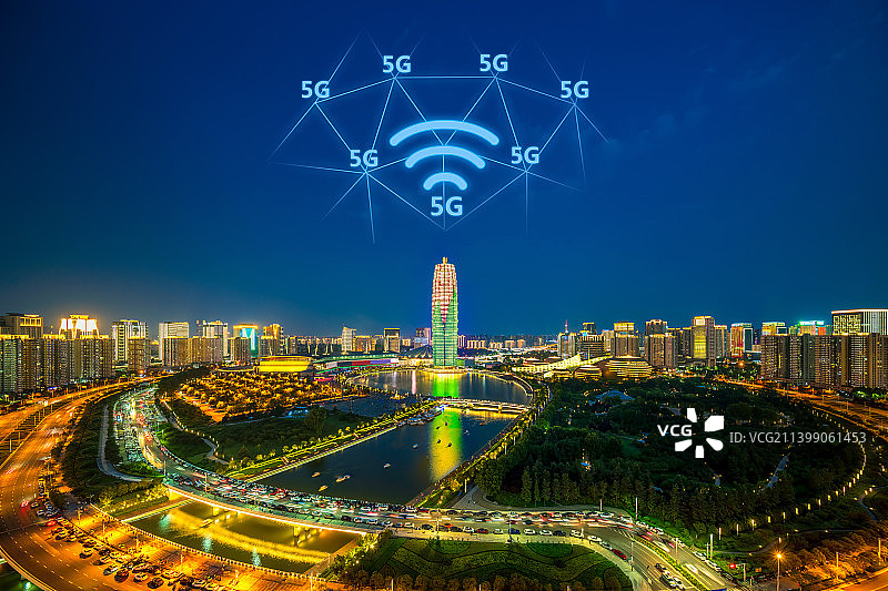河南省郑州市地标建筑郑东新区CBD千玺广场大玉米灯光秀夏季夜景户外风光高视角大数据5G物联网概念图图片素材